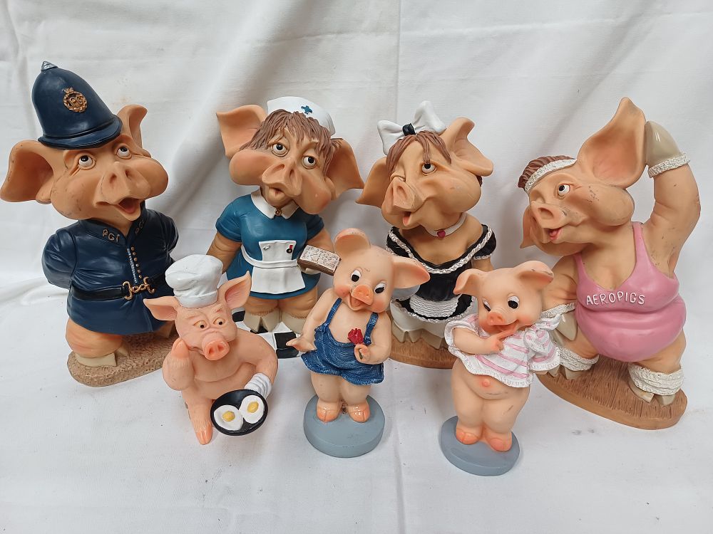 Lot 594: A Collection of Leonardo Pigs? Whimsical Painted Resin Figural Groups