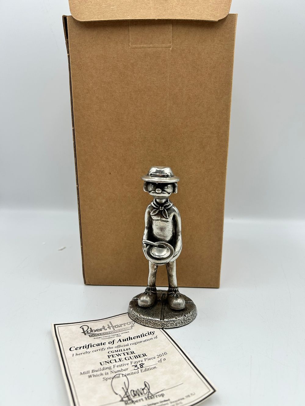 Lot 608: Robert Harrop Designs Ltd? Pewter Uncle Guber Figurine, Number 38, 2010