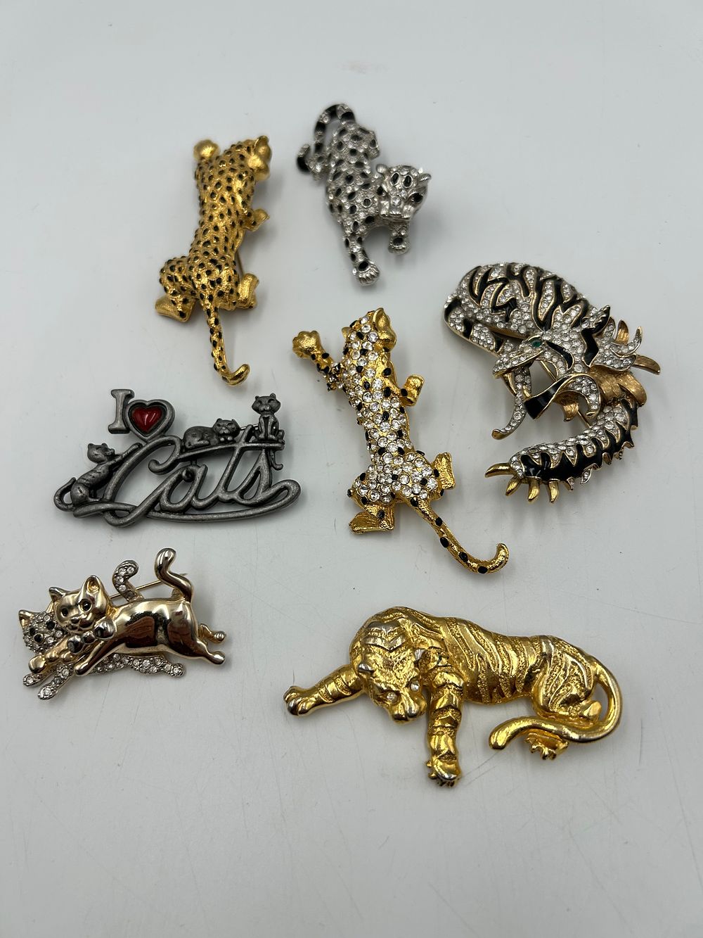 Lot 628: A Collection of Gilt Metal Effect and White Metal Big Cat Brooches