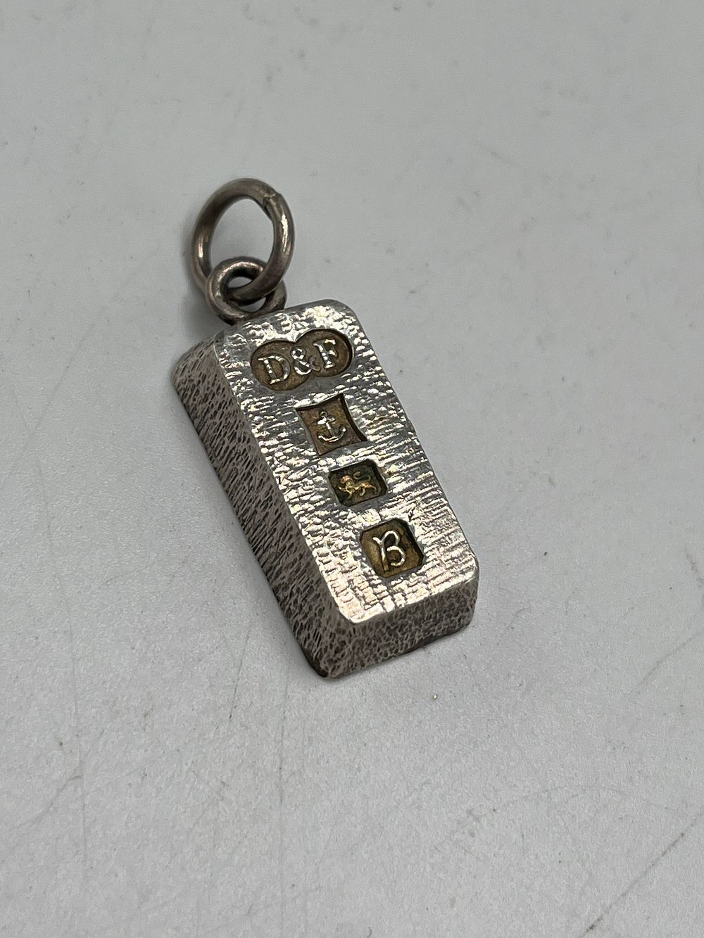 Lot 663: Elizabeth II Sterling Silver Ingot Pendant by Deakin & Francis Ltd ?, Birmingham, 1977, 22g