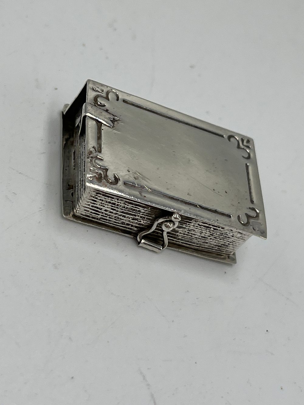 Lot 664: Sterling Silver Book-Form Pill Box / Locket, 11.50g