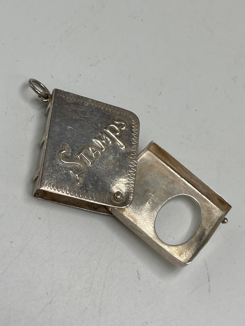 Lot 666: Late Victorian? Sterling Silver Book Form Stamp Case Pendant, 14.40g