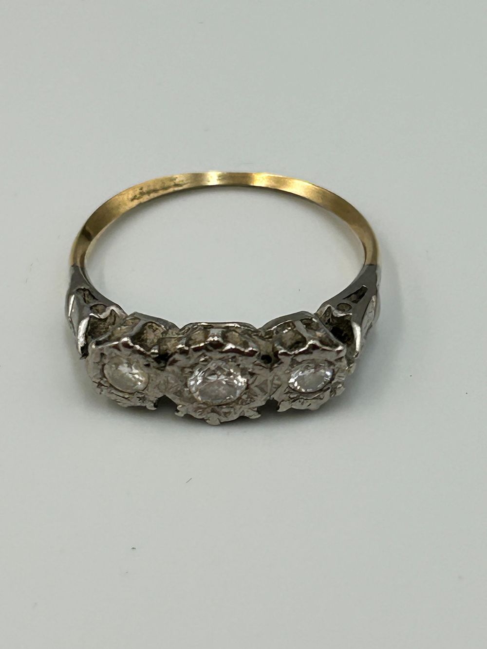 Lot 701: Late Victorian? Yellow Metal and White Metal Three Stone Diamond? Trilogy Bridge Ring 2.25g