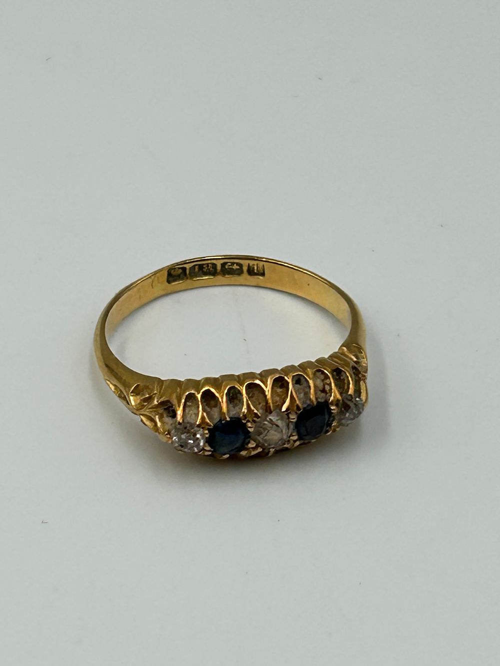 Lot 703: Victorian 18 Carat Yellow Gold Sapphire? and Diamond? Boat-Shaped Ring, 3.3g