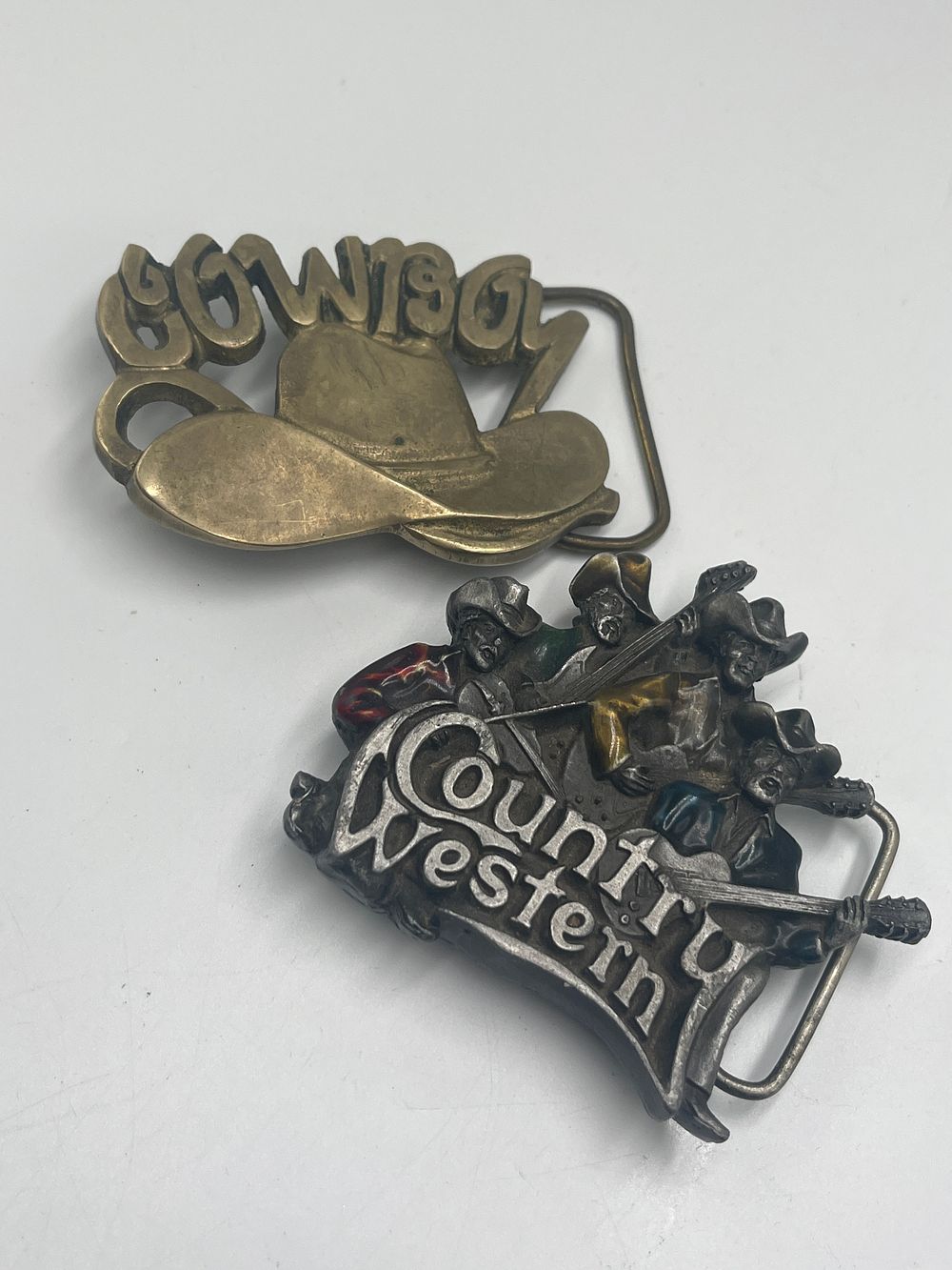 Lot 727: Two 1981 Western Novelty Belt Buckles by Baron Buckles and Bergamot Brass Works