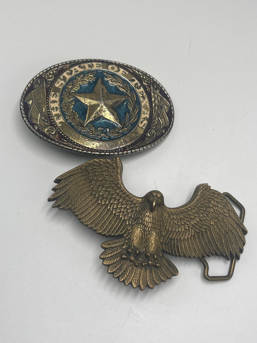 Lot 728: Two American Themed Brass Effect and Solid Brass Belt Buckles