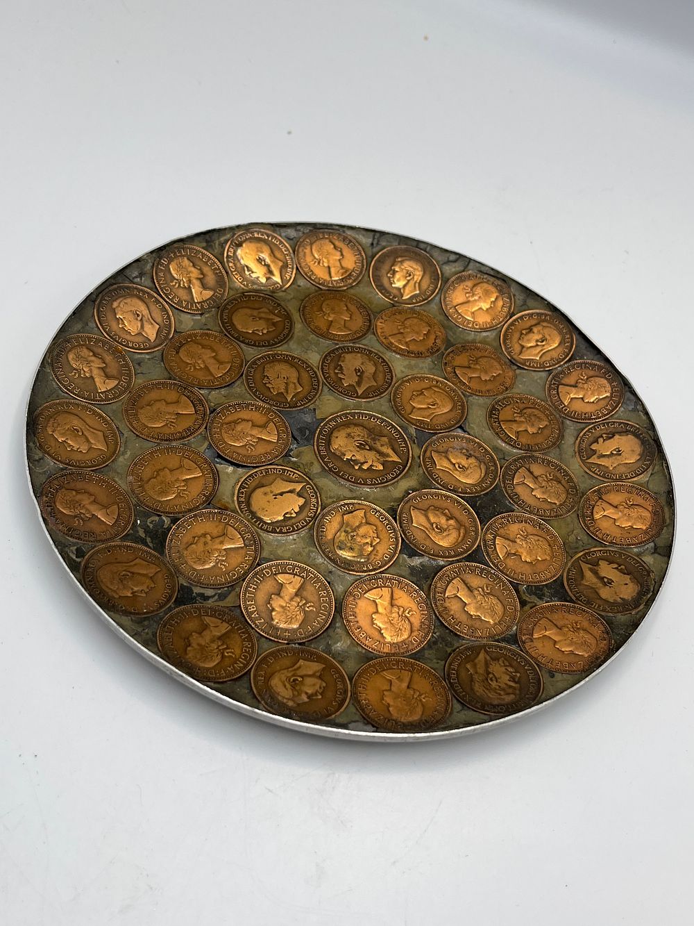 Lot 746: Elizabeth II and George VI White Metal and Resin Coin Plate, 8.5"
