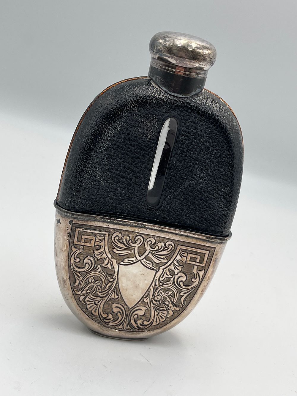 Lot 754: Victorian Style Glass and White Metal Hip Flask with Leather Mounts