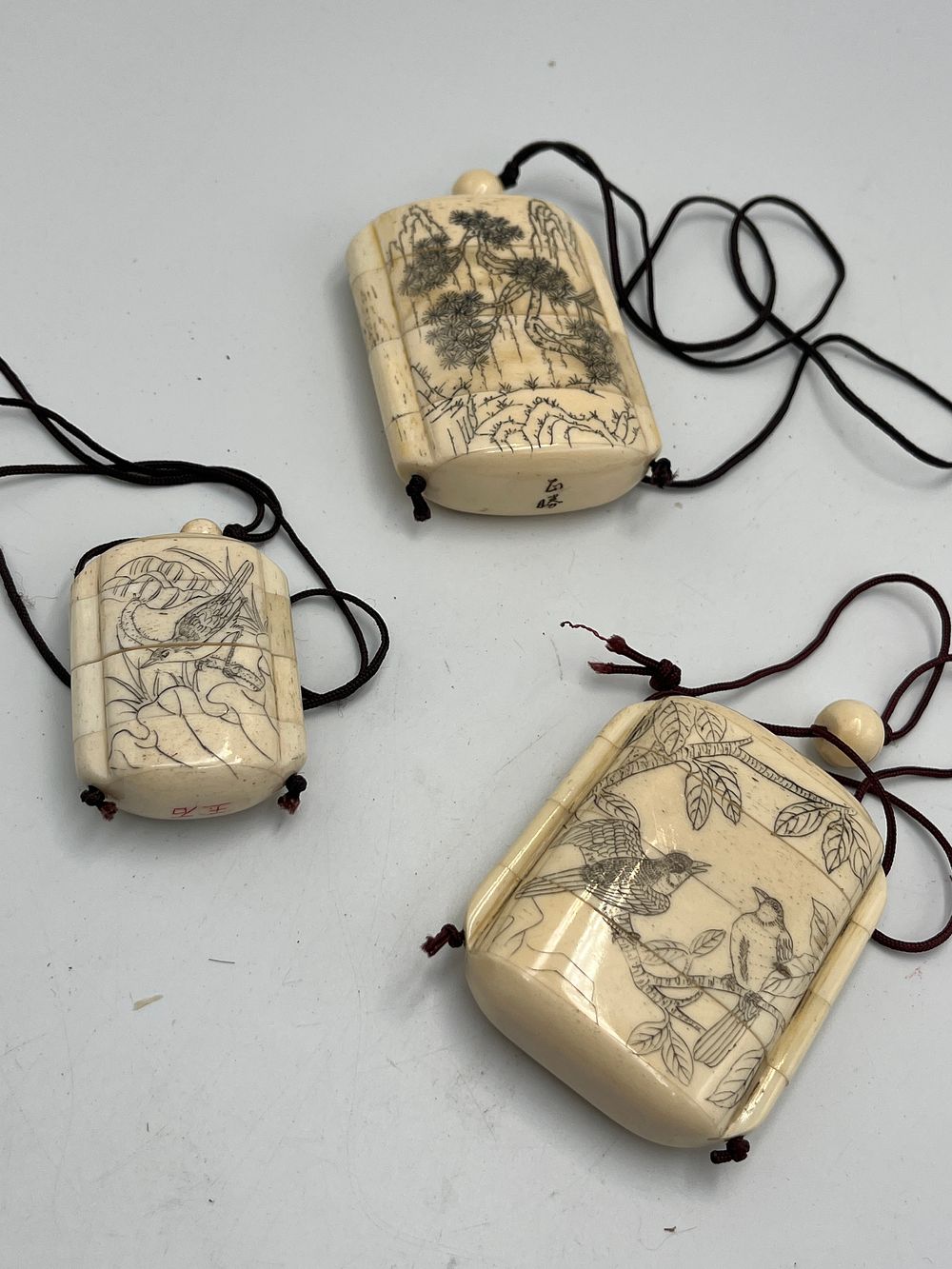 Lot 756: Three Bone? Inro With Shunga Scenes, Signed Gyokuseki? and Masanobu?, Showa Period?