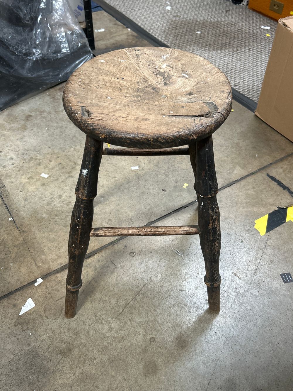 Lot 780: A Primitive? Stained Wood Three-Legged Milking Stool