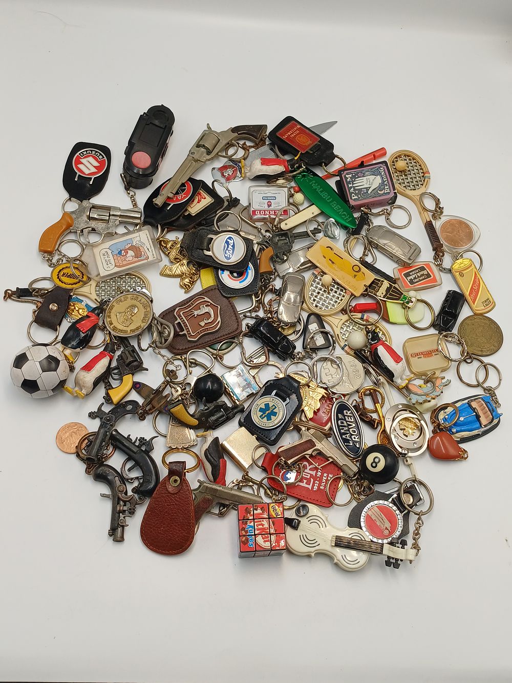 Lot 876: A Collection of Vintage Novelty and Advertising Keyrings and Fobs, 20th Century