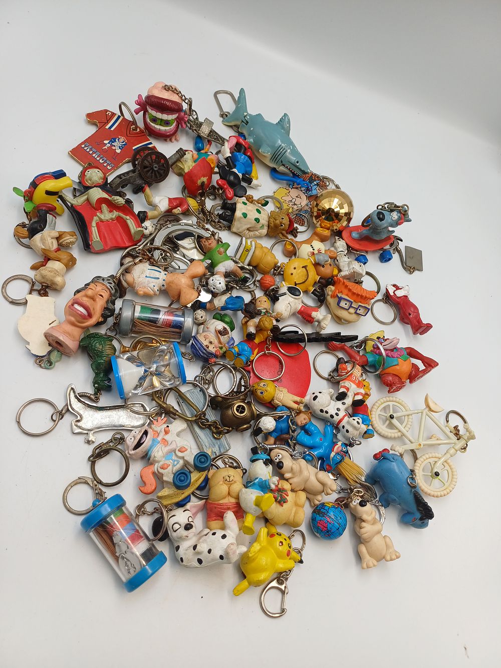 Lot 897: A Collection of Vintage Novelty and Pop Culture Character Plastic Keyrings