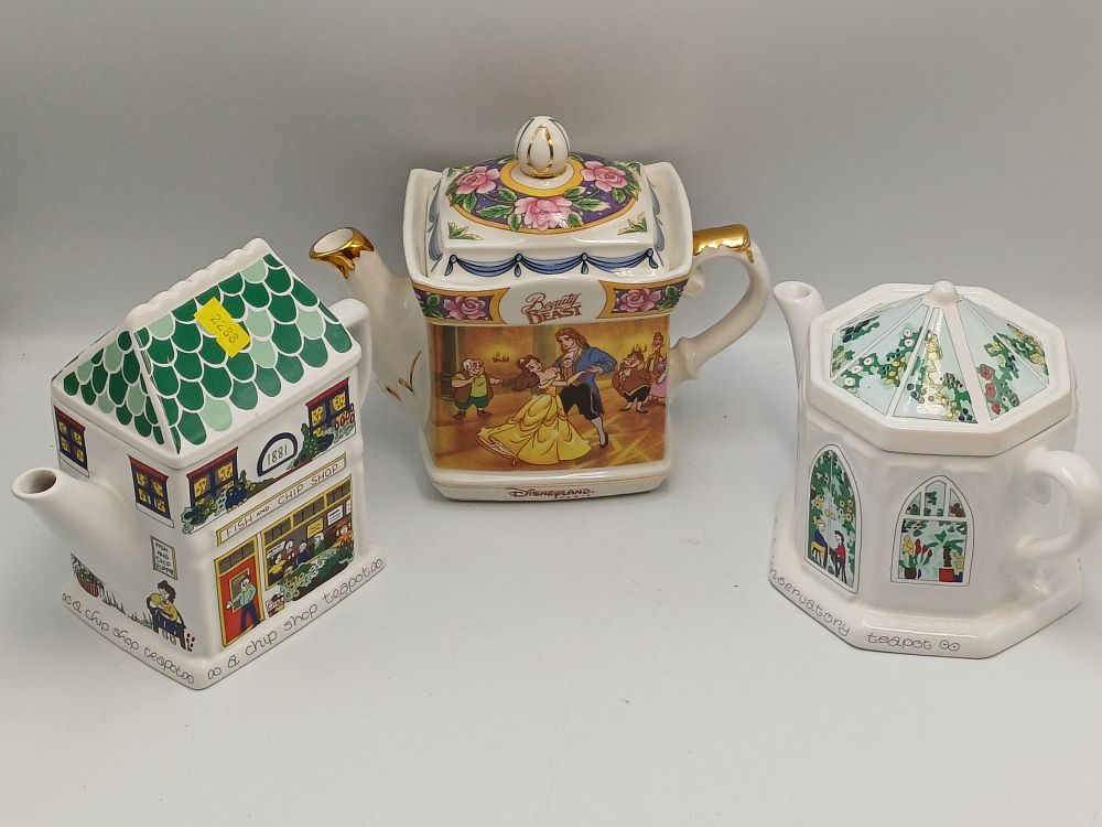 Lot 903: A Trio of Novelty Earthenware Teapots by Disneyland Paris and Wade English Life?