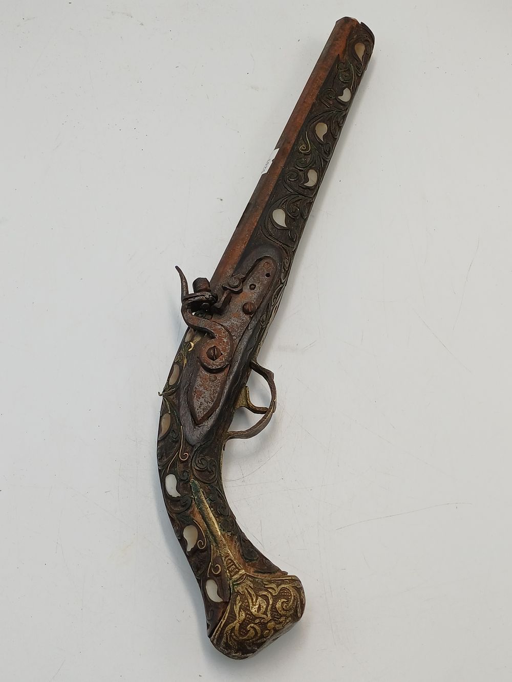 Lot 943: Moroccan? Style Carved Wood and White Metal Decorative Flintlock Pistol, 17.5"