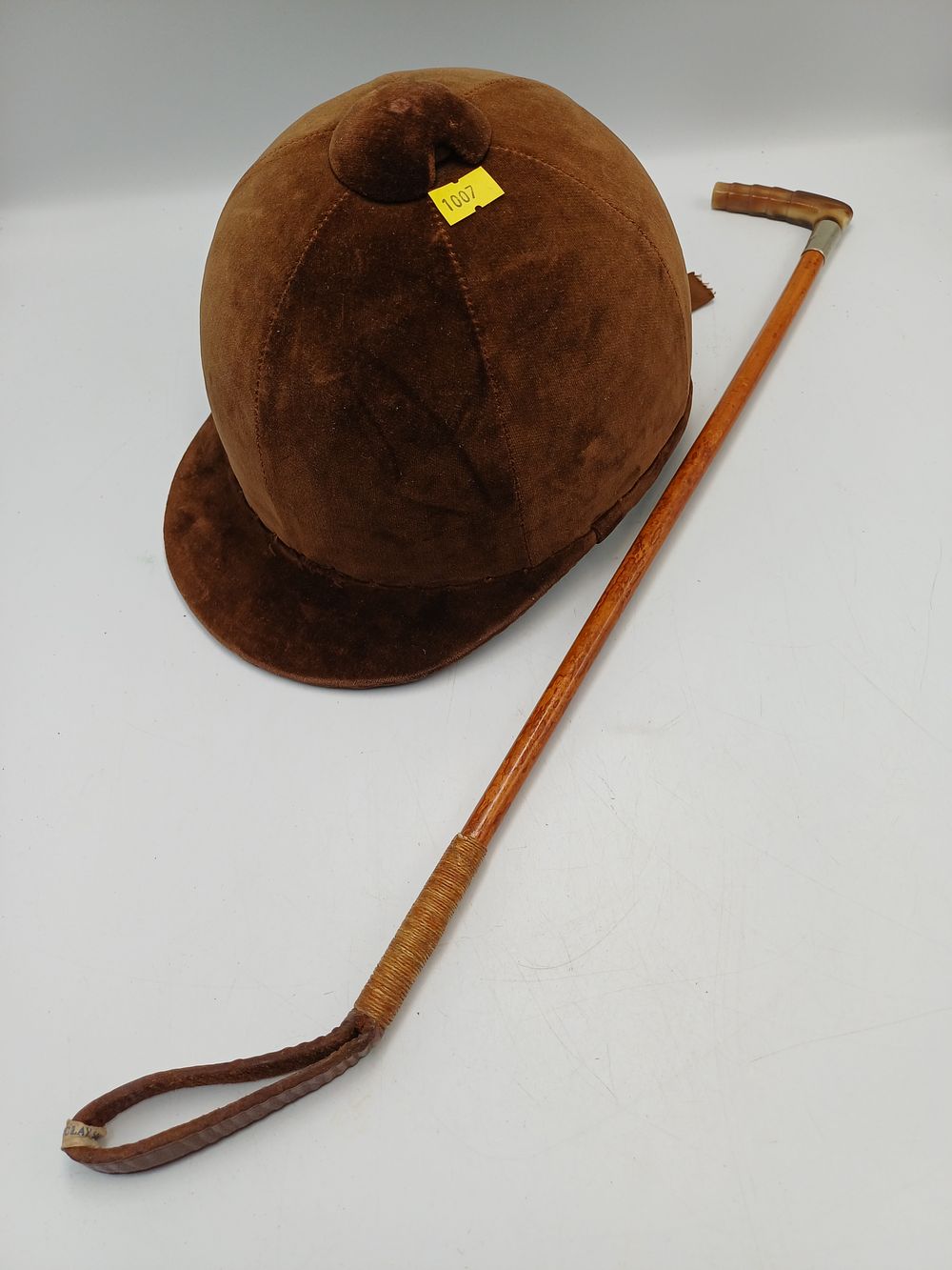 Lot 945: Mid 20th Century Child's Velvet Riding Hat and Hunt Whip by Daniel Neal & Sons Limited