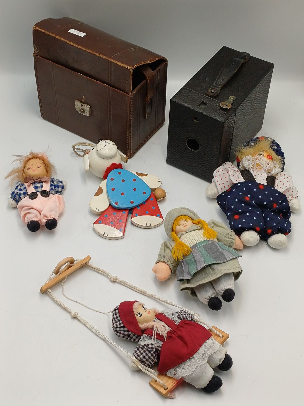 Lot 947: A Group of Traditional Cloth and Wooden Toys and Two Cased Cameras