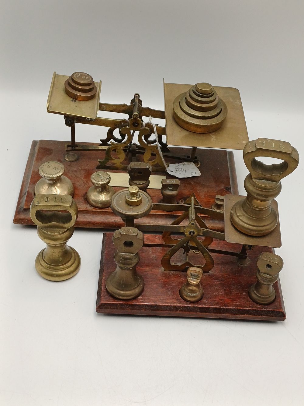 Lot 953: An Assortment of Antique Brass Postal Scales and Graduated Weights
