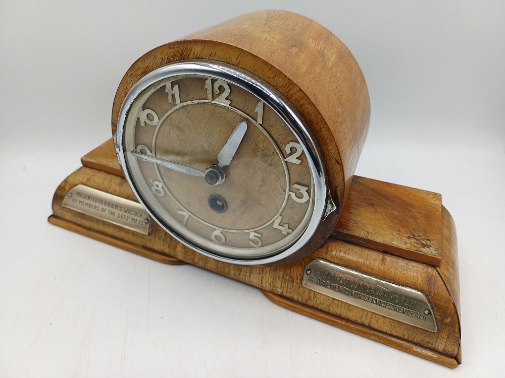 Lot 968: An Art Deco Oak Presentation Mantel Clock, 1st Battalion West Yorkshire Regiment