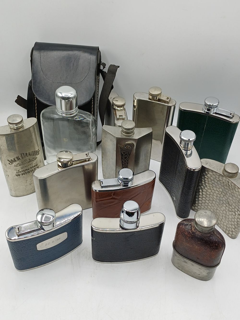 Lot 969: A Collection of Modern and Vintage White Metal Pocket Flasks