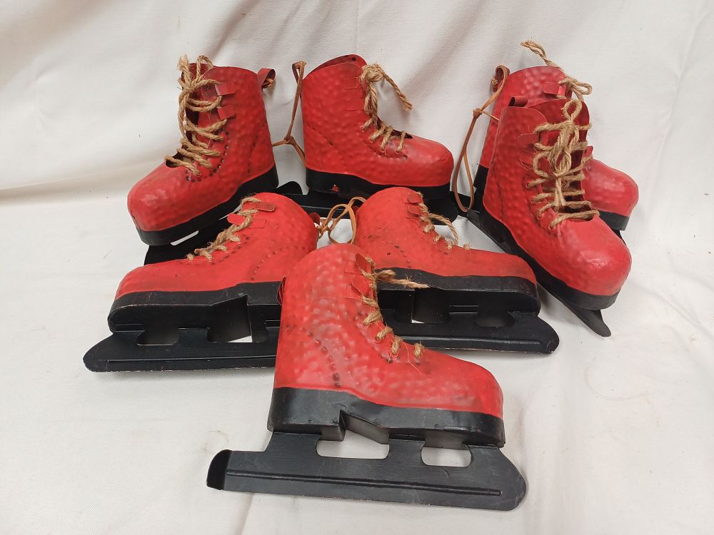 Lot 991: A Set of Six Decorative Hammered Metal Ice Skate Ornaments