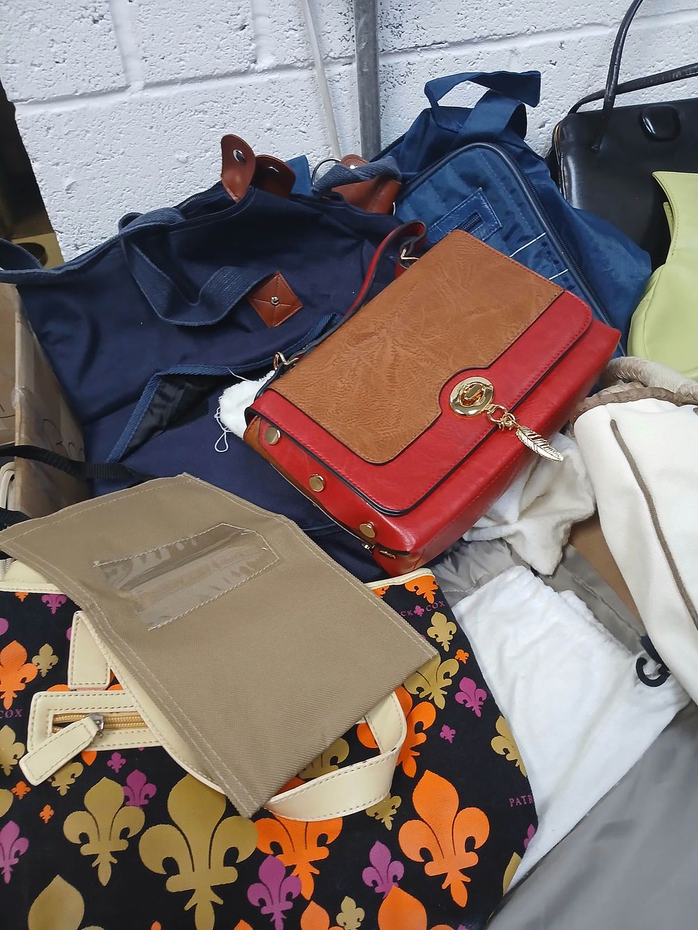 Lot 1009: An Assortment of Synthetic and Canvas Fashion Handbags and Totes