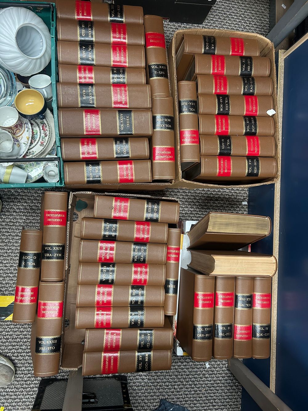 Lot 1031: A Collection of Encyclopædia Britannica Hardcover Volumes, Faux-Leather Binding?