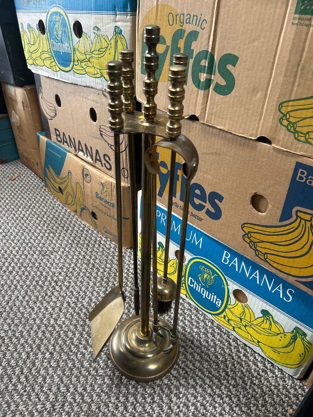 Lot 1041: A Five-Piece Brass Fireside Tool Companion Set