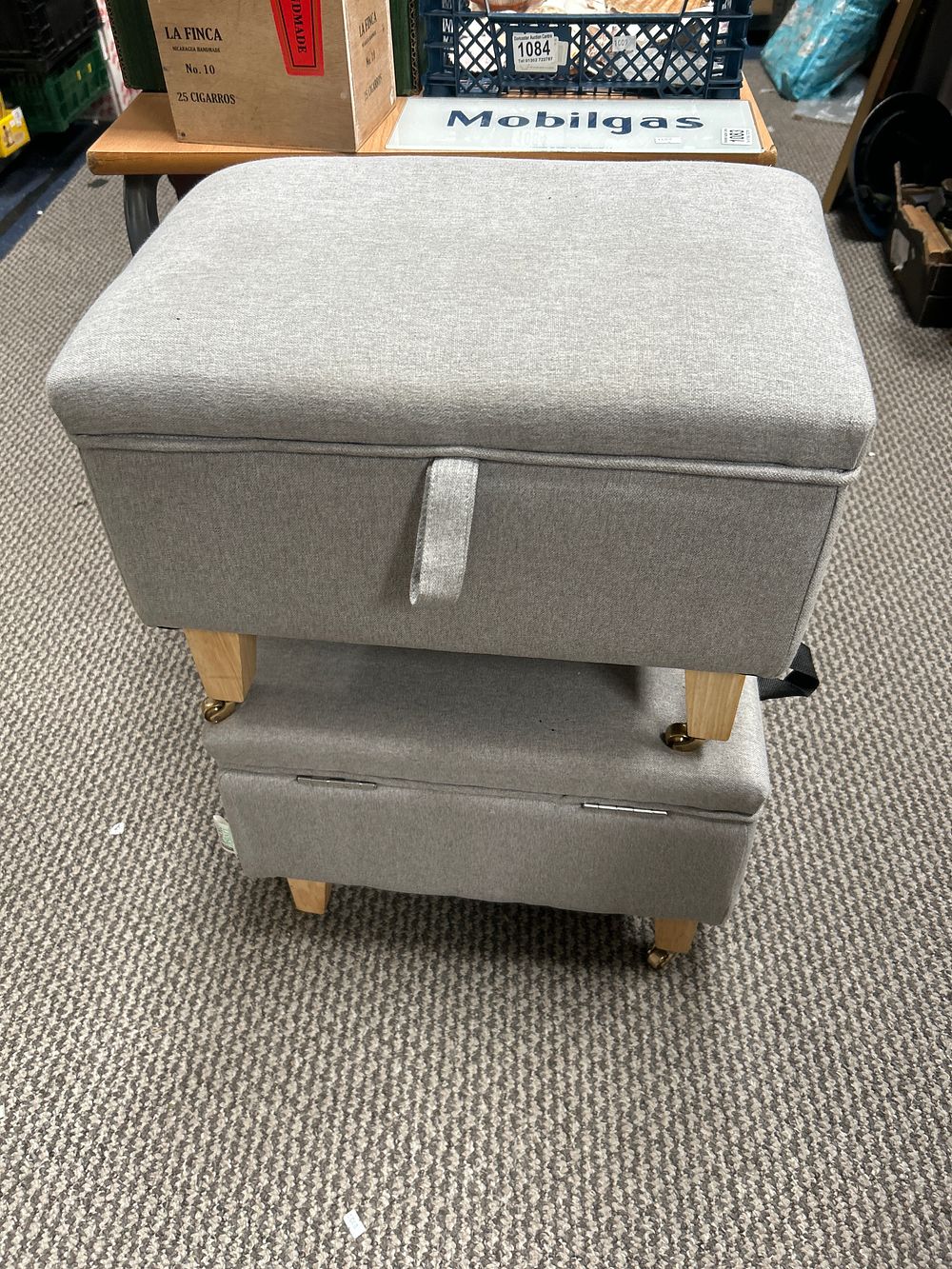 Lot 1064: Contemporary Upholstered Fabric Storage Ottoman With Casters
