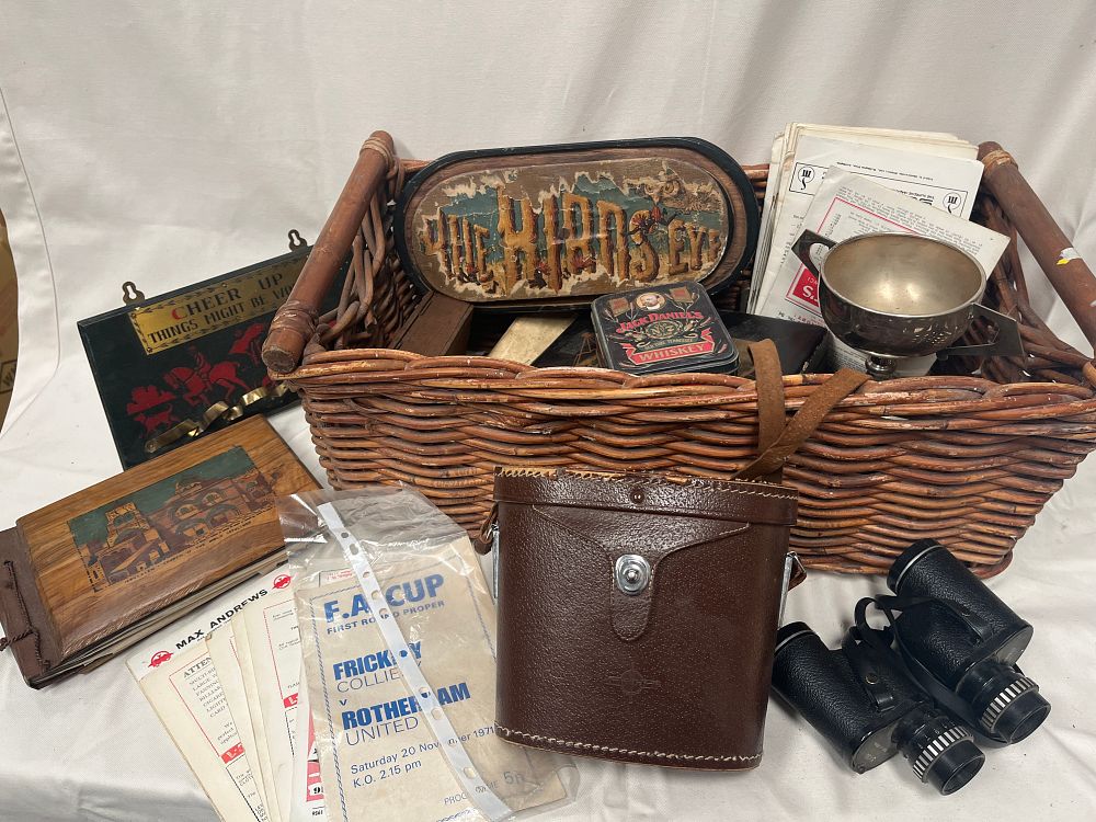 Lot 1113: A Collection of Ephemera, Binoculars and Vintage Souvenirs within a Wicker Basket