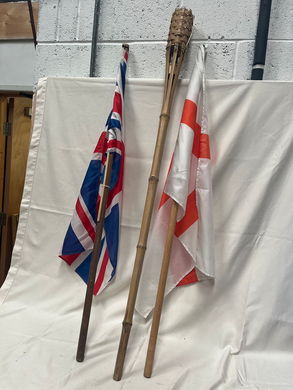 Lot 1127: A Collection of St George and Union Jack Commemorative Stick Flags and Bamboo Torch