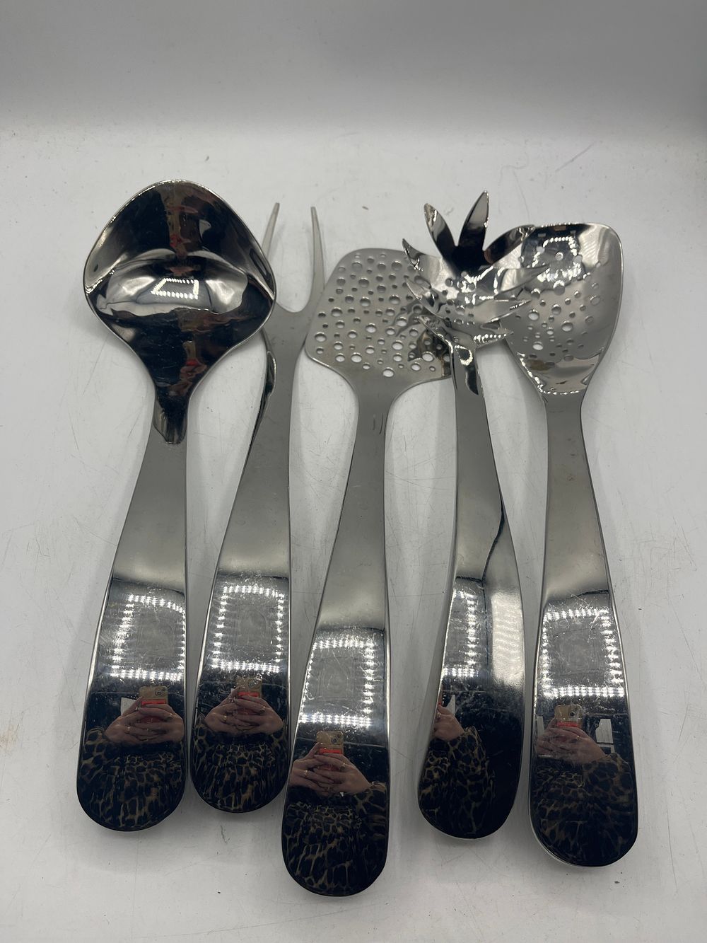 Lot 1159: A Set of Contemporary Mirror-Polished Stainless Steel Serving Utensils