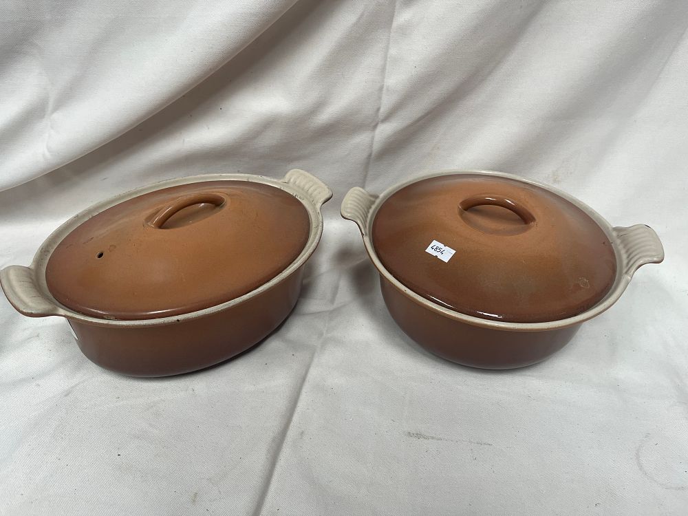Lot 1171: A Pair of Le Creuset Stoneware Lidded Casserole Dishes