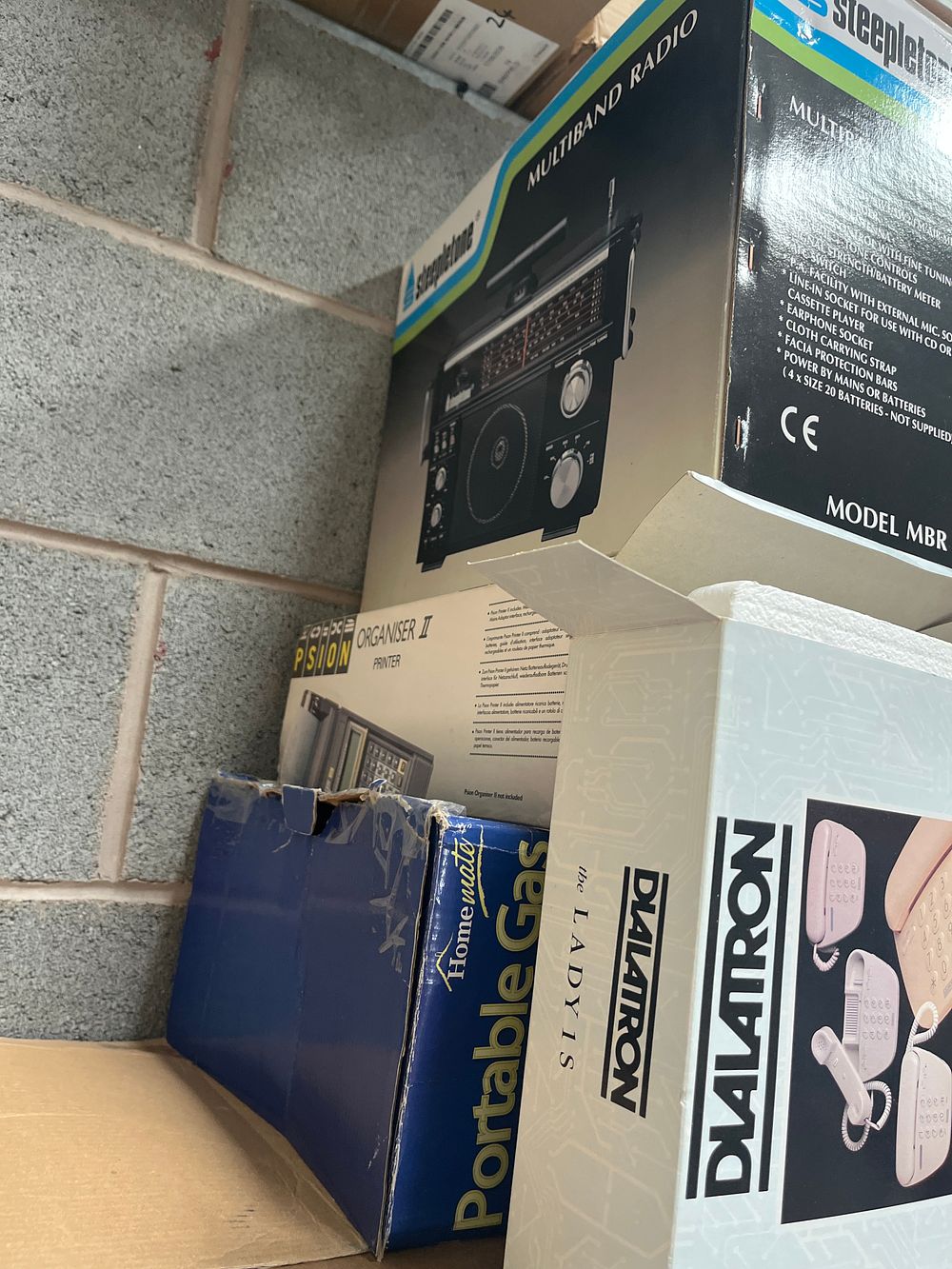 Lot 1184: A Group of Vintage Boxed Electronics Including Steepletone, Dialatron and Psion?