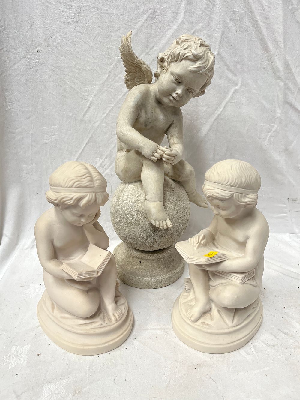 Lot 1211: A Collection of Three Reconstituted Stone? Garden Figurine Ornaments