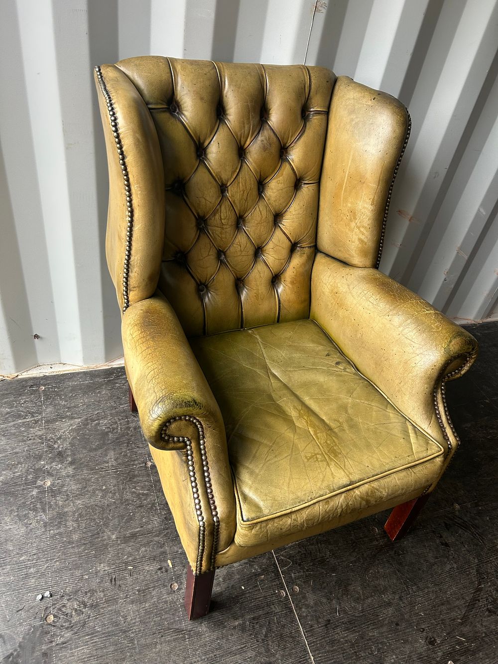 Lot 1264: A Vintage Leather Wingback Chesterfield Armchair, Moss Green?