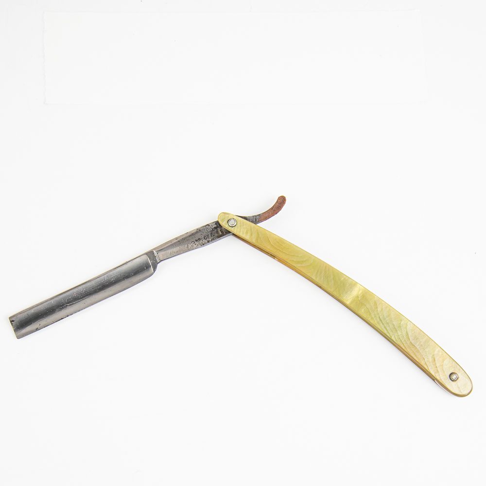 Unknown Mfg Vintage Straight Razor. Vintage Straight Razor by Unknown Mfg, with yellow-green 