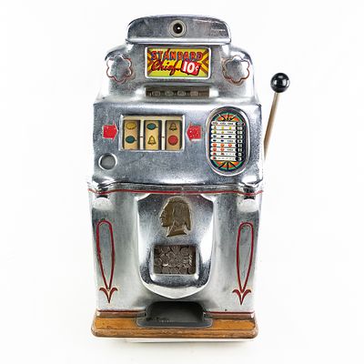 Jennings 10 Cent Standard Chief Slot Machine. Original slot is fair to good condition with lock 