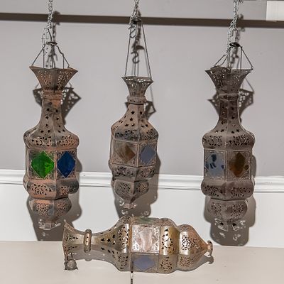 4 Moroccan Style Pierced Metal Lanterns
w/2 Rods. This striking set of four Moroccan-inspired 