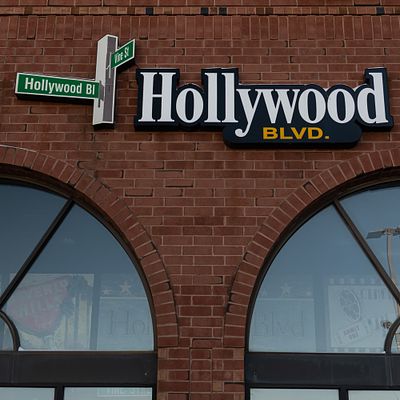 Outdoor Hollywood Blvd. Sign W/Street Signs. Pair of exterior building signage for "Hollywood 