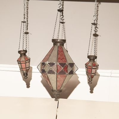 Stained Glass Hanging Lantern Trio
(3). This striking set features three hanging lanterns in a 