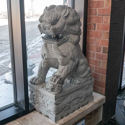Large Foo Dog. Large Chinese Foo Dog carved from stone located in theater lobby. In overall good 