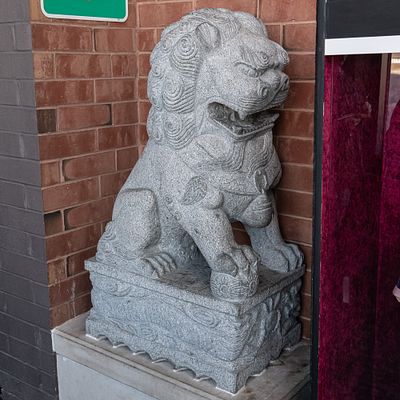 Large Foo Dog. Large Chinese Foo Dog carved from stone located in theater lobby. In overall good 