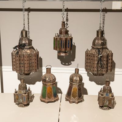 Seven Moroccan Style Pierced Metal Lamps (7). This impressive collection features seven 