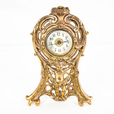 Art Nouveau Cherub Gilt Mantel Clock. This is an evocative example of turn-of-the-century Art 