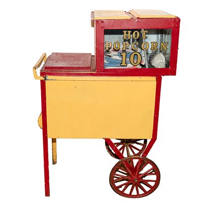 Vintage Popcorn Wagon, Cart. A vintage hand push popcorn venders cart made of metal and glass. 