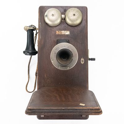 Vintage Oak Western Electric Wall Phone. This antique Western Electric oak wall phone features a 