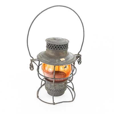 Adlake Reliable Railroad Amber Glass Lantern. An Adlake Reliable railroad lantern featuring a 