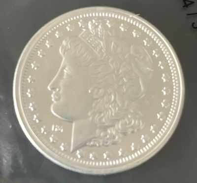 מטבע כסף טהור 999 (1 אונקיה) 31.1 גרם חדש U.N.C - מורגן דולר Morgan Dollar