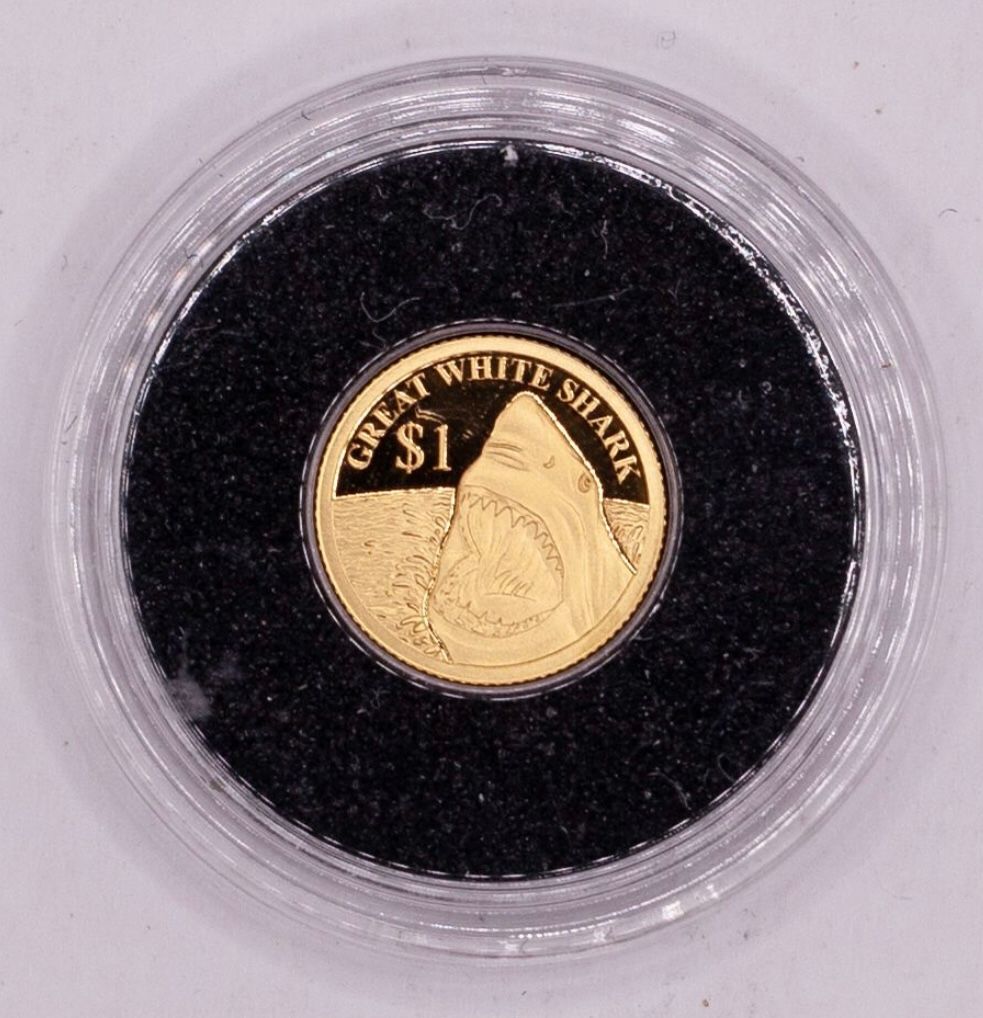 מטבע זהב בקפסולה במשקל חצי גרם, איי פיג׳י, זהב 999 מצב חדש.