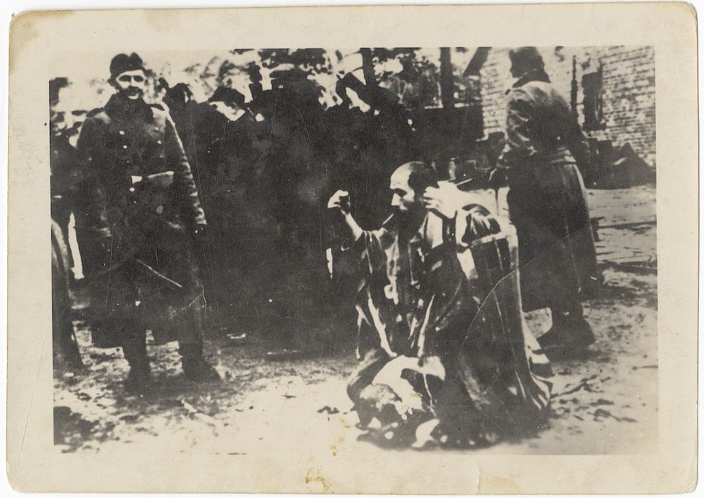 A photograph of the humiliation of Jews by Nazi soldiers. [Łuk&oacute;w], 1942. A photograph of the 
